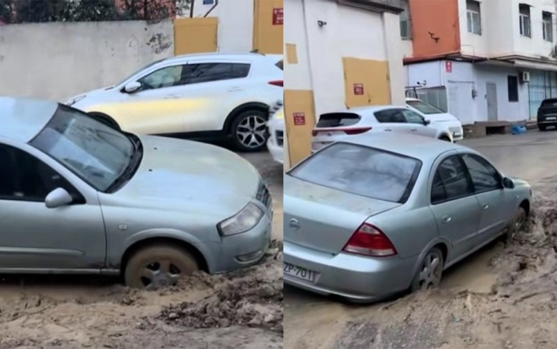 Binanın həyəti çökdü, maşın çuxura düşdü - VİDEO